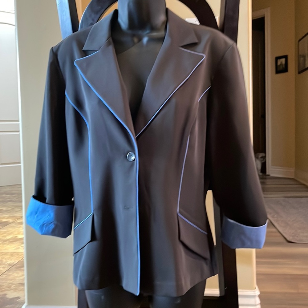 Suit jacket.  Dark gray with blue trim.